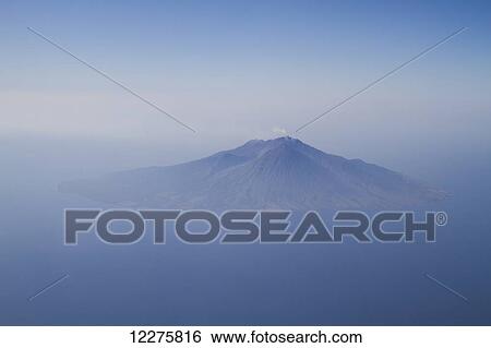 Stock Photograph - Aerial view of Sangeang Api Island with Sangeang Api Volcano, East Nusa Tenggara, Indonesia. Fotosearch