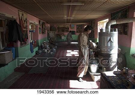 Stock Photograph - Afghan Man Looking At The Samovar In A Bamiyan Restaurant, Bamian Province, Afghanistan. Fotosearch