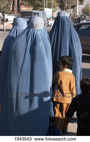 Afghan Women Wearing Burqas And Boy In Charikar, Parwan Province, Afghanistan View Large Photo Image Stock Image - Afghan Women Wearing Burqas And Boy In Charikar, Parwan Province, Afghanistan. Fotosearch