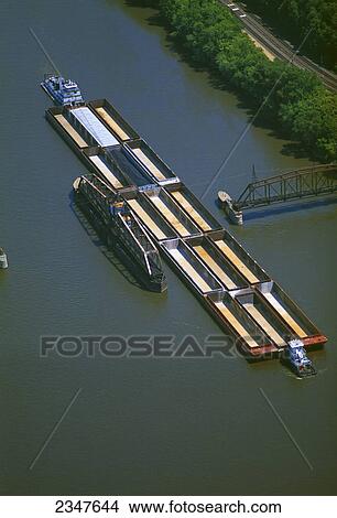 Agriculture - Aerial view of an empty grain barge on the Mississippi River passing through a swing bridge / near Dubuque, Iowa, USA. View Large Photo Image Picture - Agriculture - Aerial view of an empty grain barge on the Mississippi River passing through a swing bridge / near Dubuque, Iowa, USA.. Fotosearch