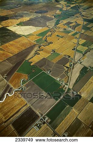Agriculture - Aerial view of cultivated and fallow agricultural fields with a highway and river passing through / near Idaho Falls, Idaho, USA. View Large Photo Image Stock Photo - Agriculture - Aerial view of cultivated and fallow agricultural fields with a highway and river passing through / near Idaho Falls, Idaho, USA.. Fotosearch