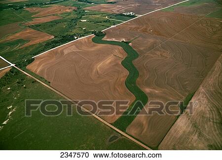 Agriculture - Aerial view of fallow agricultural land with a grassy waterway bisecting the field / near Stockton, Kansas, USA. View Large Photo Image Stock Image - Agriculture - Aerial view of fallow agricultural land with a grassy waterway bisecting the field / near Stockton, Kansas, USA.. Fotosearch