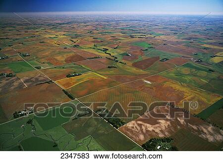 Stock Image - Agriculture - Aerial view of farmsteads and agricultural fields in Autumn / near Yankton, South Dakota, USA.. Fotosearch