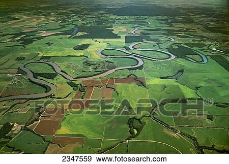 Stock Photo - Agriculture - Aerial view of patterned agricultural fields, with the White River snaking between them / near Augusta, Arkansas, USA.. Fotosearch