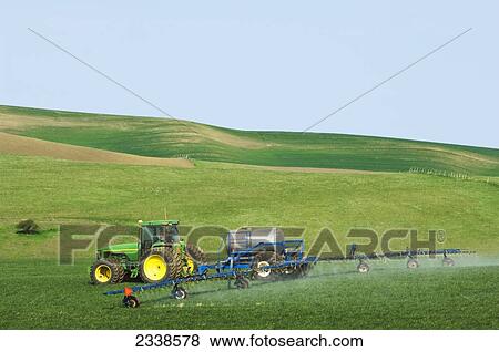 Agriculture - Ground application of herbicide for weed control on a field of early growth winter wheat / near Pullman, Palouse Region, Washington, USA. View Large Photo Image Stock Photo - Agriculture - Ground application of herbicide for weed control on a field of early growth winter wheat / near Pullman, Palouse Region, Washington, USA.. Fotosearch