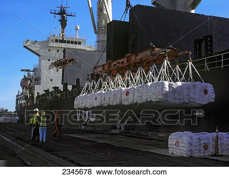 Stock Photo - Agriculture - Pallets of rice is loaded onto a ship at the Port of Sacramento / Sacramento, California, USA.. Fotosearch