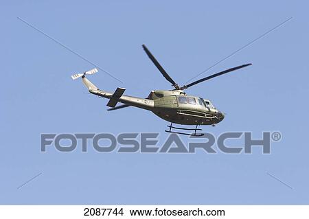 Picture - Aid Helicopter Flying Over Garhi Dopatta After The 8 October 2005 Earthquake, Azad Jammu & Kashmir, Pakistan. Fotosearch