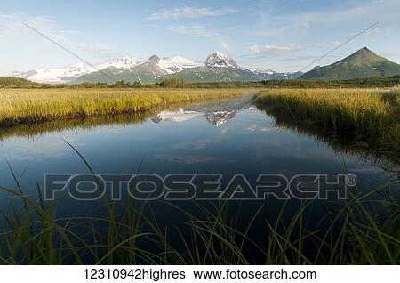 Alaska landscape with mountains reflected in the tranquil water, Katmai National Park; Alaska, United States of America View Large Photo Image Stock Photograph - Alaska landscape with mountains reflected in the tranquil water, Katmai National Park; Alaska, United States of America. Fotosearch