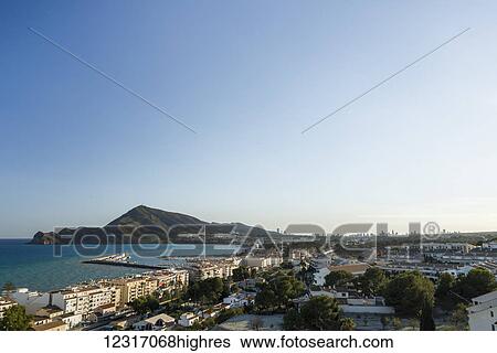 Stock Photograph - Altea is a beautiful town in Costa Blanca, landscape and cityscape from the top of the downtown; Altea, Alicante, Spain. Fotosearch