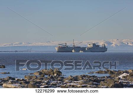 Stock Photo - An Alaska military cargo ship in Cook Inlet, Anchorage, Southcentral Alaska, Winter. Fotosearch