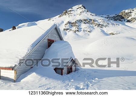 Stock Photograph - An old building from mining days in Independence Mine in Hatcher Pass in winter, South-central Alaska; Alaska, United States of America. Fotosearch
