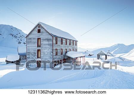 Stock Photograph - An old building from mining days in Independence Mine in Hatcher Pass in winter, South-central Alaska; Alaska, United States of America. Fotosearch