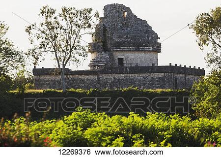 Ancient Mayan Observatory with highlighted shrubs in the foreground; Chichen Itza, Yucatan, Mexico View Large Photo Image Stock Photograph - Ancient Mayan Observatory with highlighted shrubs in the foreground; Chichen Itza, Yucatan, Mexico. Fotosearch