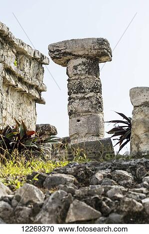 Stock Image - Ancient Mayan round column with flat stone on top; Tulum, Quintana Roo, Mexico. Fotosearch