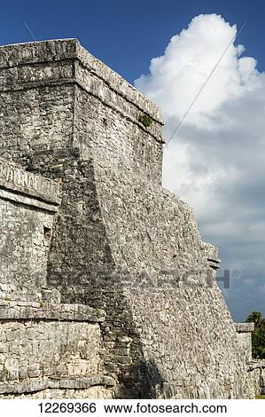 Ancient Mayan Temple back wall with blue sky and clouds; Tulum, Quintana Roo, Mexico View Large Photo Image Stock Photograph - Ancient Mayan Temple back wall with blue sky and clouds; Tulum, Quintana Roo, Mexico. Fotosearch