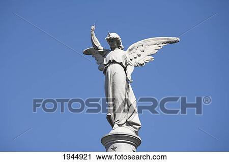 Stock Image - Angel Statue Atop A Mausoleum At The Cementerio De La Recoleta, Buenos Aires, Capital Federal, Argentina. Fotosearch