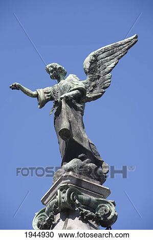 Stock Image - Angel Statue Atop A Mausoleum At The Cementerio De La Recoleta, Buenos Aires, Capital Federal, Argentina. Fotosearch