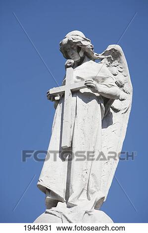 Stock Image - Angel Statue Atop A Mausoleum At The Cementerio De La Recoleta, Buenos Aires, Capital Federal, Argentina. Fotosearch