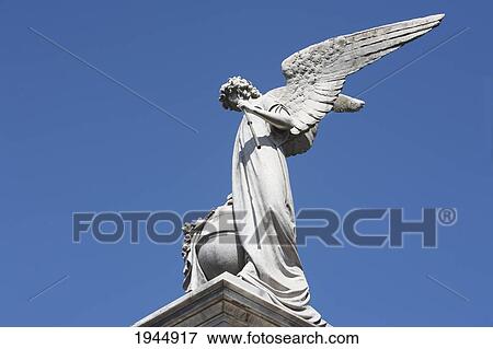 Stock Photo - Angel Statue Atop A Mausoleum At The Cementerio De La Recoleta, Buenos Aires, Capital Federal, Argentina. Fotosearch