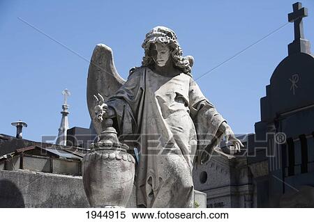 Stock Photography - Angel Statue Atop A Mausoleum At The Cementerio De La Recoleta, Buenos Aires, Capital Federal, Argentina. Fotosearch