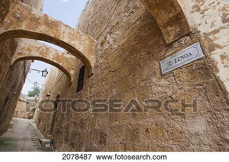 Stock Photo - Arches Over A Street In The Citadel, Victoria (Rabat), Gozo Island, Malta. Fotosearch