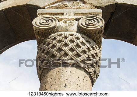Stock Photograph - Armenian ionic capital on top of one of the reconstructed columns of Zvartnots Cathedral; Armavir Province, Armenia. Fotosearch