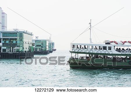 Stock Photo - Arriving to Pier Central in Hong Kong Island by public boat; Hong Kong, China. Fotosearch