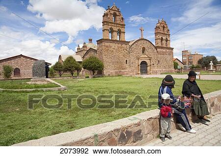 Aymara People Sitting On The Plaza In Front Of The 16Th Century Church, Laja, La Paz Department, Bolivia View Large Photo Image Stock Image - Aymara People Sitting On The Plaza In Front Of The 16Th Century Church, Laja, La Paz Department, Bolivia. Fotosearch