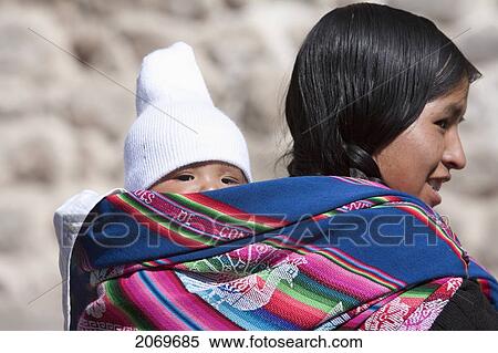 Aymara Woman Carrying A Baby On Her Back, Potos View Large Photo Image Stock Photography - Aymara Woman Carrying A Baby On Her Back, Potos. Fotosearch
