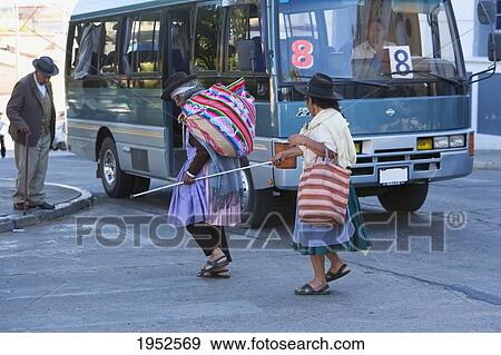 Aymara Woman Helping A Blind Woman To Cross The Street, Cementerio General, Sucre, Chuquisaca Department, Bolivia View Large Photo Image Stock Photo - Aymara Woman Helping A Blind Woman To Cross The Street, Cementerio General, Sucre, Chuquisaca Department, Bolivia. Fotosearch