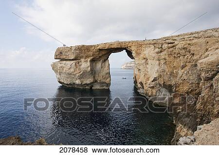Azure Window, A Natural Rock Arch, Dwejra Bay, Gozo Island, Malta View Large Photo Image Stock Photo - Azure Window, A Natural Rock Arch, Dwejra Bay, Gozo Island, Malta. Fotosearch