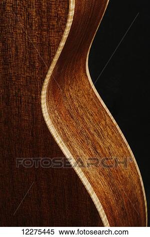 Stock Photography - Back and side of an acoustic guitar showing the binding and grain of of the wood; United States of America. Fotosearch