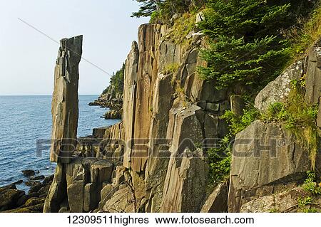 Stock Photograph - Balancing rock, basalt rock cliffs, Bay of Fundy; Long Island, Nova Scotia, Canada. Fotosearch