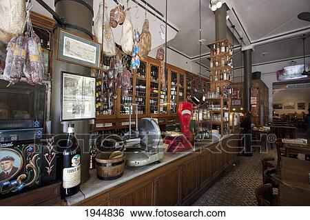 Stock Photograph - Bar El Almacén, Buenos Aires. At The Ground Floor Of A 1915 Building, This Café And Bar Used To Be A Grocery And Liquor Store. Restoration Has Maintained The Café's Original Spirit, As The Old Furniture Was Kept., Capital Federal, Argentina. Fotosearch