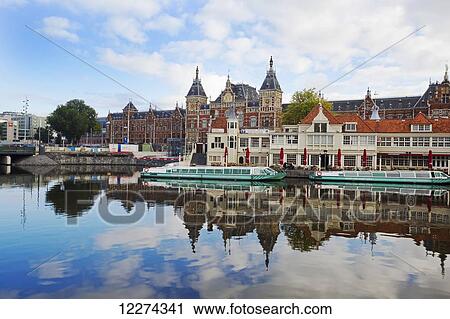 Beautiful train station, Central Station, at the heart of the city; Amsterdam, Holland View Large Photo Image Stock Image - Beautiful train station, Central Station, at the heart of the city; Amsterdam, Holland. Fotosearch