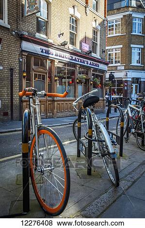 Bikes parked outside a pub in Shoreditch; London, England View Large Photo Image Stock Photo - Bikes parked outside a pub in Shoreditch; London, England. Fotosearch