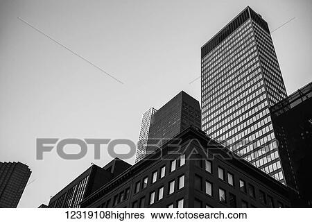 Black and white low angle view of skyscrapers and office buildings; New York City, New York, United States of America View Large Photo Image Stock Photograph - Black and white low angle view of skyscrapers and office buildings; New York City, New York, United States of America. Fotosearch