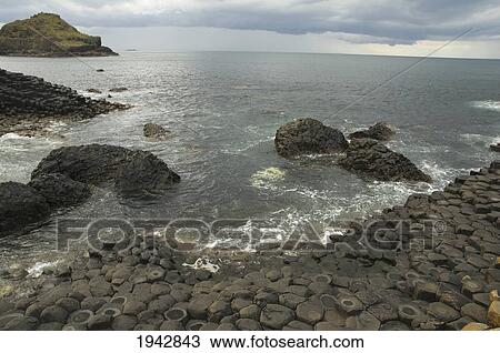 Black Basalt Columns Sticking Out Of The Sea, Giant's Causeway, Northern Ireland, United Kingdom View Large Photo Image Stock Image - Black Basalt Columns Sticking Out Of The Sea, Giant's Causeway, Northern Ireland, United Kingdom. Fotosearch