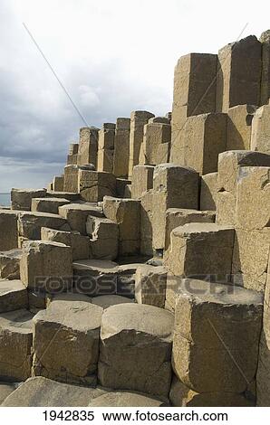 Stock Photography - Black Basalt Columns Sticking Out Of The Sea, Giant's Causeway, Northern Ireland, United Kingdom. Fotosearch