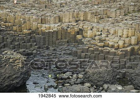 Stock Photography - Black Basalt Columns Sticking Out Of The Sea, Giant's Causeway, Northern Ireland, United Kingdom. Fotosearch