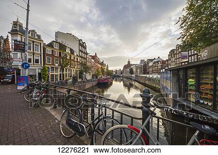 Stock Image - Bloemenmarkt, the world's only floating flower market, located at the Singel canal; Amsterdam, Netherlands. Fotosearch