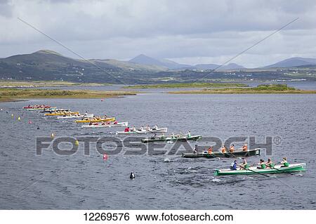 Stock Photograph - Boats lined up for the All Ireland Rowing Championships; Waterville, County Kerry, Ireland . Fotosearch