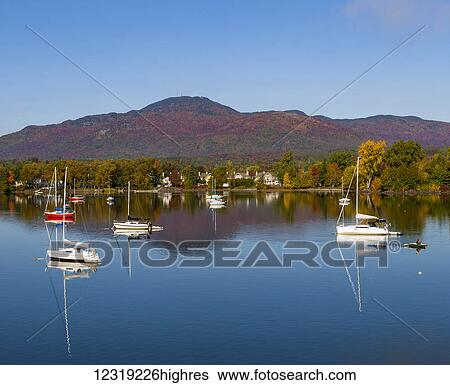 Stock Photograph - Boats on Lake Memphrmagog in autumn; Magog, Quebec, Canada. Fotosearch