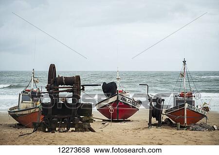 Stock Photo - Boats on the beach; Punta del Diablo, Uruguay. Fotosearch