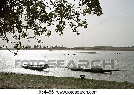 Stock Photograph - Boats on the Niger River in Mopti, Mali. Fotosearch