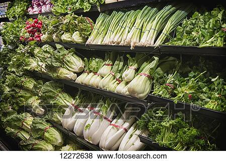 Stock Photo - Bok Choy and other greens in display at supermarket; Selingsgrove, Pennsylvania, United States of America. Fotosearch