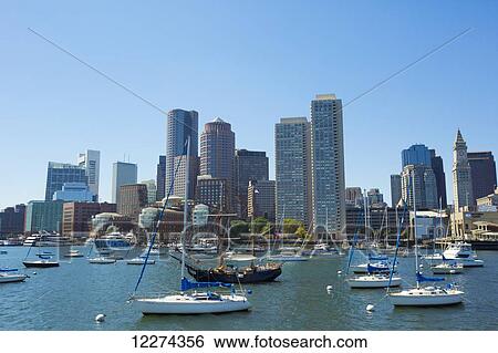 Stock Photograph - Boston skyline as seen from the bay; Boston, Massachusetts, United States of America. Fotosearch