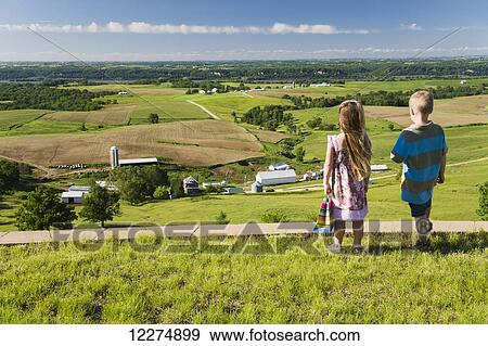 Stock Photo - Boy and girl enjoying the scenery of the Mississippi River Valley as seen from Balltown; Iowa, United States of America. Fotosearch