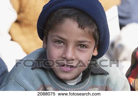 Stock Photography - Boy Attending A Class In The Grounds Of A School In Destroyed By The 8 October 2005 Earthquake, Chakothi, Azad Kashmir, Pakistan. Fotosearch
