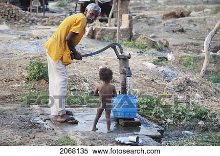 Boy Getting A Bath At The Well, Rajgir, Bihar, India View Large Photo Image Stock Photography - Boy Getting A Bath At The Well, Rajgir, Bihar, India. Fotosearch